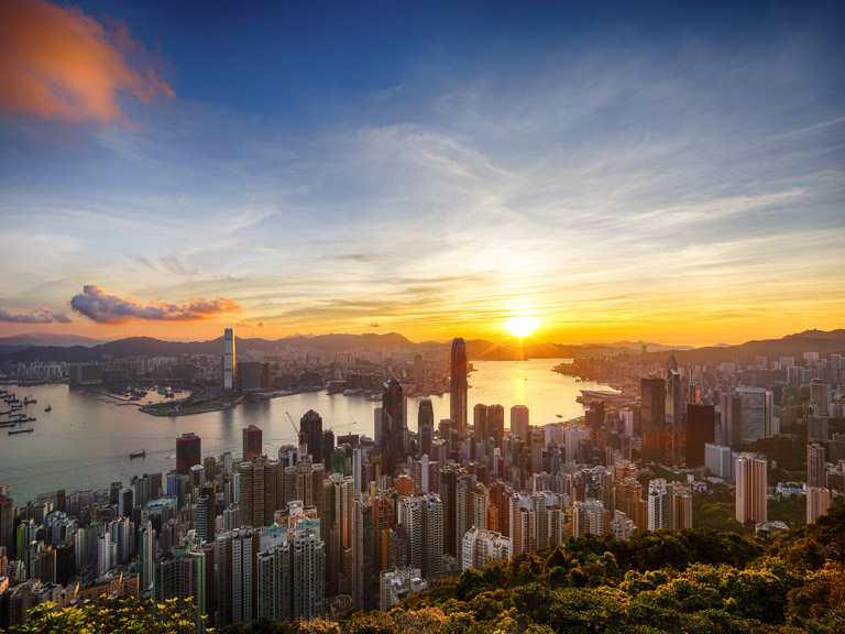 A view of the Hong Kong skyline at sunset